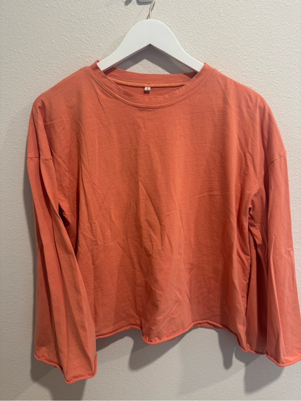 Women's Long-Sleeve Crewneck Top - Coral with bell sleeves